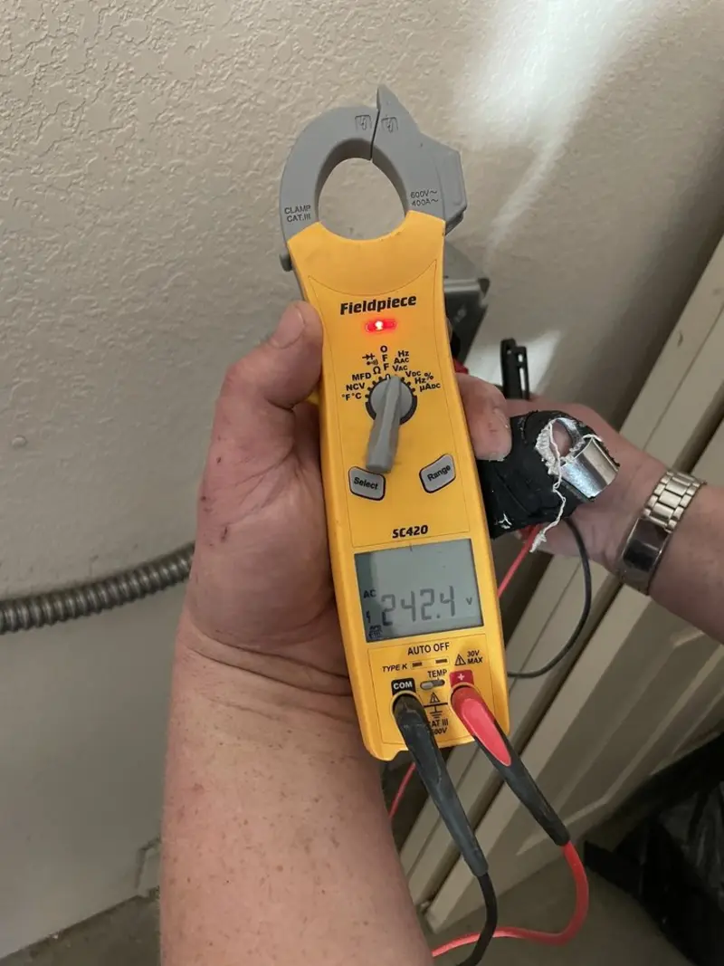 Voltage testing with clamp meter during Ceiling Fan Installation in Fairmont
